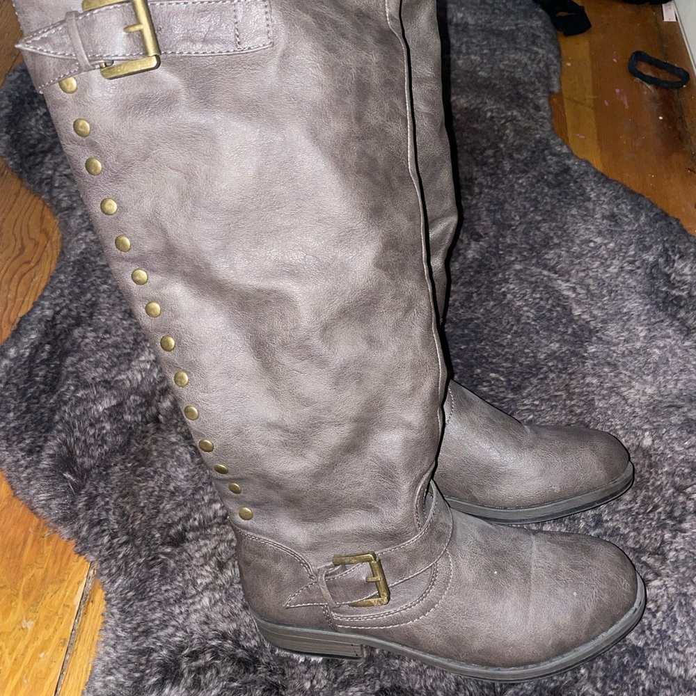 Grey studded riding boots with buckles